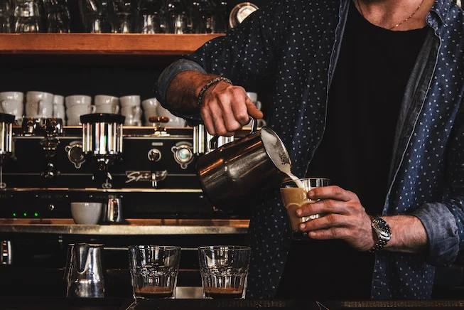 Image of Barista pouring and brewing coffee at Fernwood Coffee Company in Fernwood Victoria BC