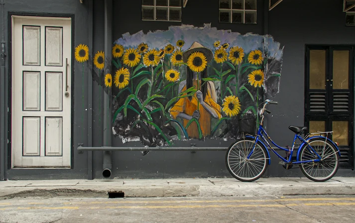 Image of mural with girl in field of sunflowers in Fernwood